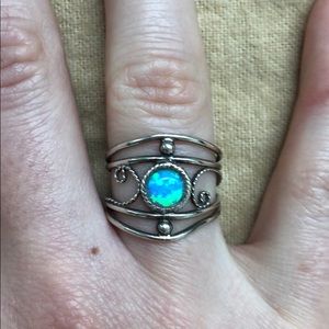 Stunning handcrafted silver ring with blue gem